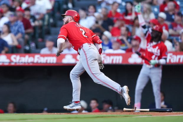 Cincinnati Reds designated hitter Gavin Lux runs after hitting a...