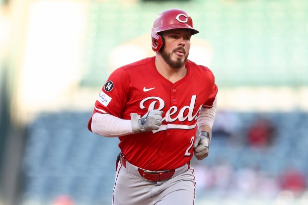 Cincinnati Reds designated hitter Gavin Lux runs the bases after...
