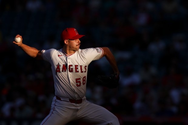 Angels starting pitcher Victor Mederos throws to a Cincinnati Reds...