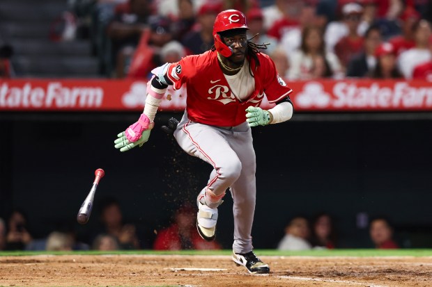 The Cincinnati Reds’ Elly De La Cruz drops his bat...