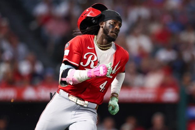 The Cincinnati Reds’ Elly De La Cruz runs after hitting...