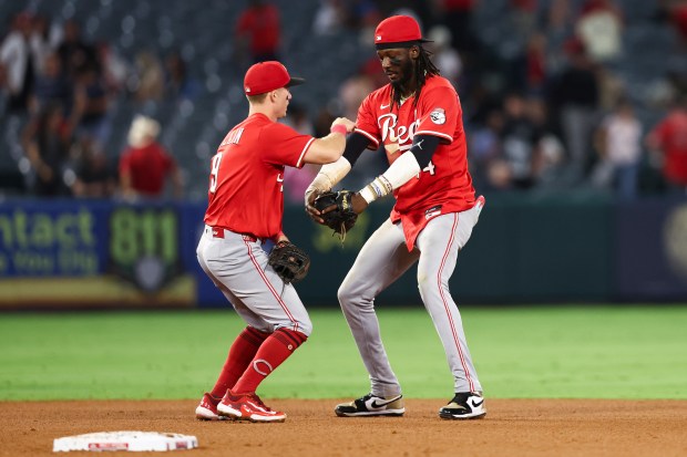 Cincinnati Reds second baseman Matt McLain, left, and shortstop Elly...