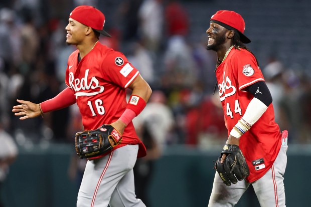 Cincinnati Reds shortstop Elly De La Cruz (44) reacts alongside...