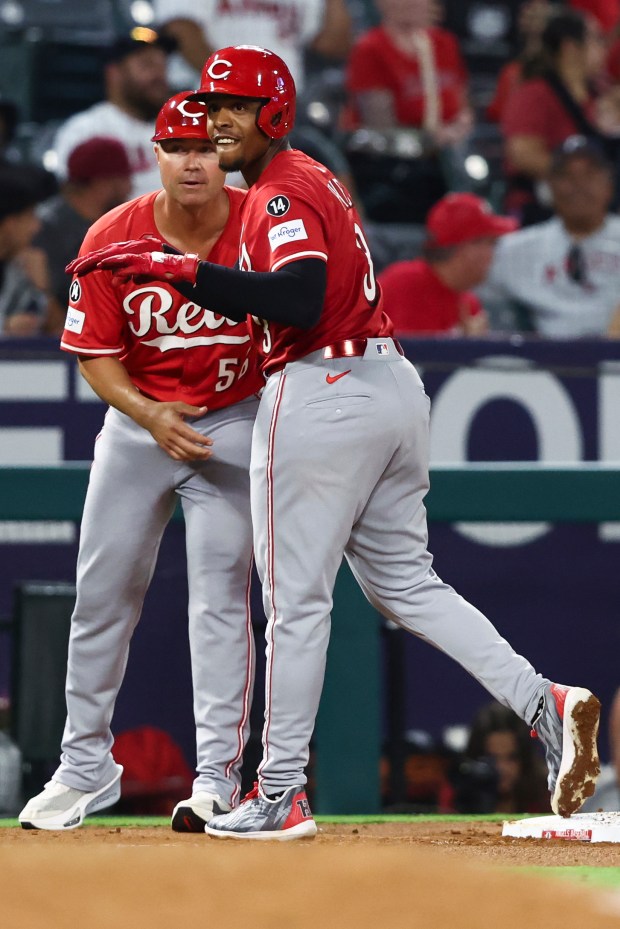 Cincinnati Reds’ Ke’Bryan Hayes celebrates after hitting a triple as...