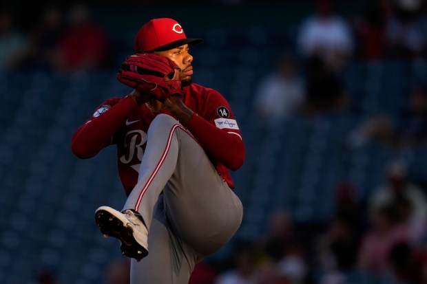 Cincinnati Reds starting pitcher Hunter Greene throws to the plate...