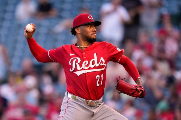 Cincinnati Reds starting pitcher Hunter Greene throws to the plate...