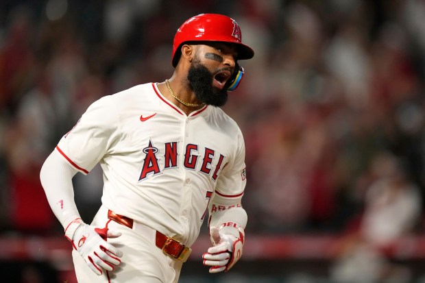 The Angels’ Jo Adell celebrates after hitting a game-tying solo...