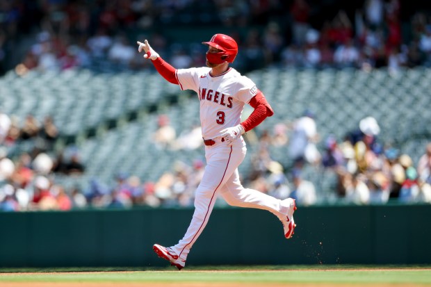 The Angels’ Taylor Ward celebrates after hitting a home run...