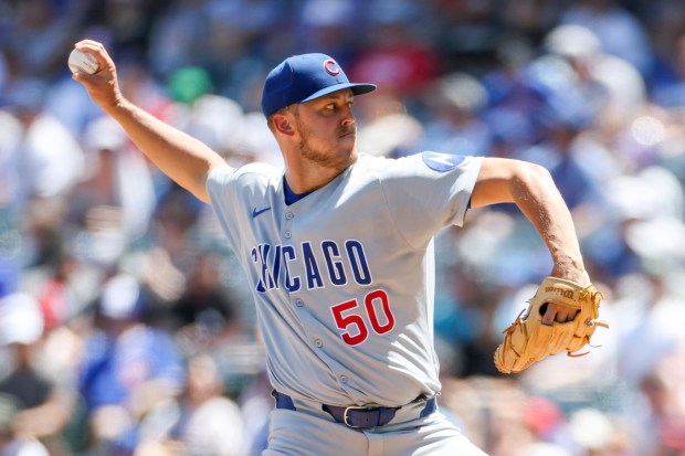 Chicago Cubs starting pitcher Jameson Taillon delivers during the first...