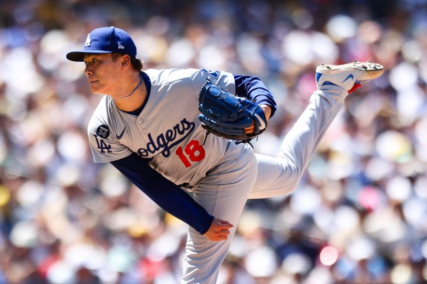 Los Angeles Dodgers’ Yoshinobu Yamamoto follows through on a pitch...