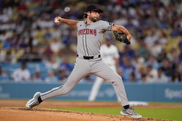 Arizona Diamondbacks starting pitcher Zac Gallen throws to the plate...