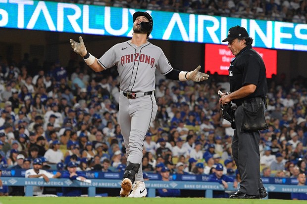The Arizona Diamondbacks’ Blaze Alexander scores after hitting a two-run...