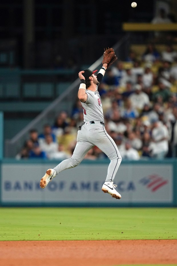 Arizona Diamondbacks second baseman Blaze Alexander can’t get to a...