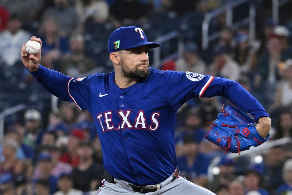 Texas Rangers pitcher throwing a baseball.