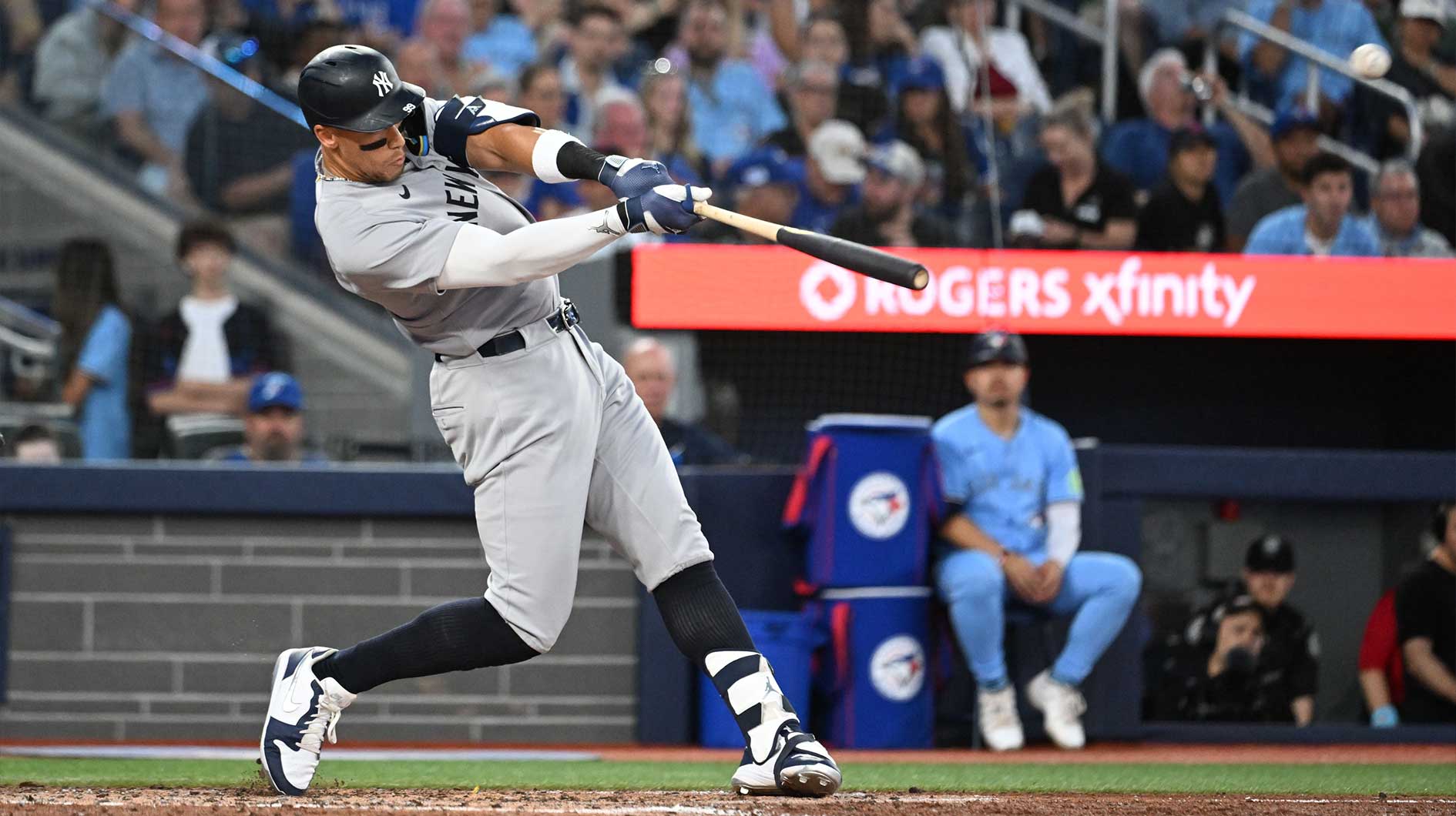 Jul 23, 2025; Toronto, Ontario, CAN; New York Yankees designated hitter Aaron Judge (99) hits a two run home run against the Toronto Blue Jays in the sixth inning at Rogers Centre. 