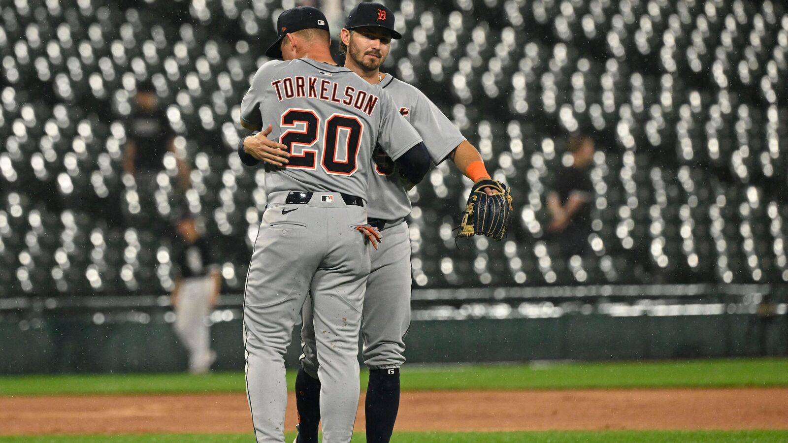 Detroit Tigers first base Spencer Torkelson (20) hugs third baseman  Zach McKinstry (39) after the game against the Chicago White Sox at Rate Field.