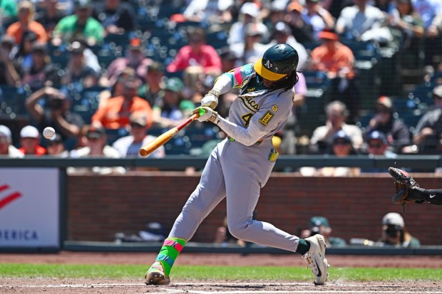 Athletics' Lawrence Butler (4) connects for a two-run single in the fourth inning of their MLB game at Oracle Park in San Francisco, Calif., on Sunday, May 18, 2025. (Jose Carlos Fajardo/Bay Area News Group)
