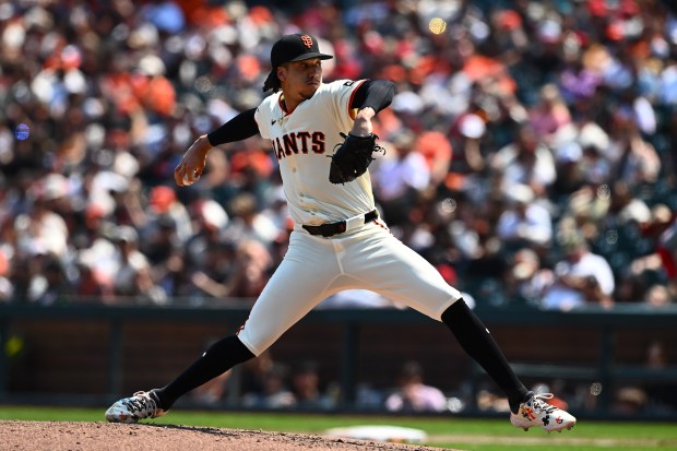 San Francisco Giants pitcher Spencer Bivens (76) pitches against the...
