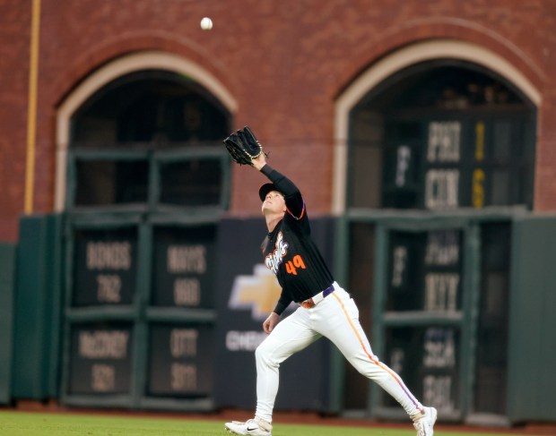 San Francisco Giants' Tyler Fitzgerald (49) makes a catch for an out in right field on a ball hit by San Diego Padres' Manny Machado (13) in the third inning at Oracle Park in San Francisco, Calif., on Tuesday, Aug. 12, 2025. (Nhat V. Meyer/Bay Area News Group)