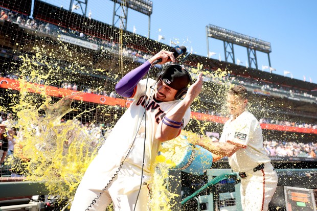 Matt Chapman #26 throws Gatorade on Willy Adames #2 of the San Francisco Giants after they beat the Chicago Cubs at Oracle Park on Aug. 28, 2025 in San Francisco, California. (Photo by Ezra Shaw/Getty Images)