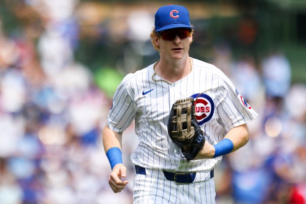 Chicago Cubs outfielder Owen Caissie (19) runs off the field after he caught a long line drive to end the top of the second inning against the Milwaukee Brewers at Wrigley Field on Monday, Aug. 18, 2025. (Eileen T. Meslar/Chicago Tribune)