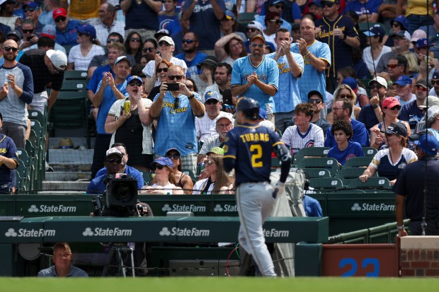 Milwaukee Brewers fans cheer after Milwaukee Brewers second base Brice Turang (2) scored on a solo homer during the third inning against the Chicago Cubs at Wrigley Field on Monday, Aug. 18, 2025. (Eileen T. Meslar/Chicago Tribune)