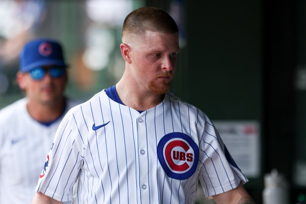 Chicago Cubs pitcher Cade Horton (22) walks in the dugout after leaving the game after being checked on by a trainer during the third inning against the Milwaukee Brewers at Wrigley Field on Monday, Aug. 18, 2025. (Eileen T. Meslar/Chicago Tribune)