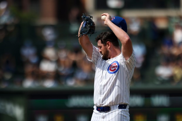Chicago Cubs pitcher Luke Little wipes his face off after giving up a walk during the sixth inning against the Milwaukee Brewers at Wrigley Field on Monday, Aug. 18, 2025. (Eileen T. Meslar/Chicago Tribune)
