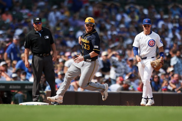 Milwaukee Brewers catcher Danny Jansen (33) runs to third base during the sixth inning against the Chicago Cubs at Wrigley Field on Monday, Aug. 18, 2025. (Eileen T. Meslar/Chicago Tribune)