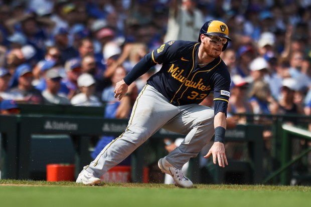 Milwaukee Brewers catcher Danny Jansen (33) runs back to third base during the sixth inning against the Chicago Cubs at Wrigley Field on Monday, Aug. 18, 2025. (Eileen T. Meslar/Chicago Tribune)