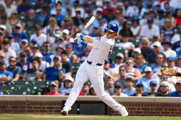Chicago Cubs outfielder Owen Caissie (19) hits a single during the seventh inning against the Milwaukee Brewers at Wrigley Field on Monday, Aug. 18, 2025. (Eileen T. Meslar/Chicago Tribune)