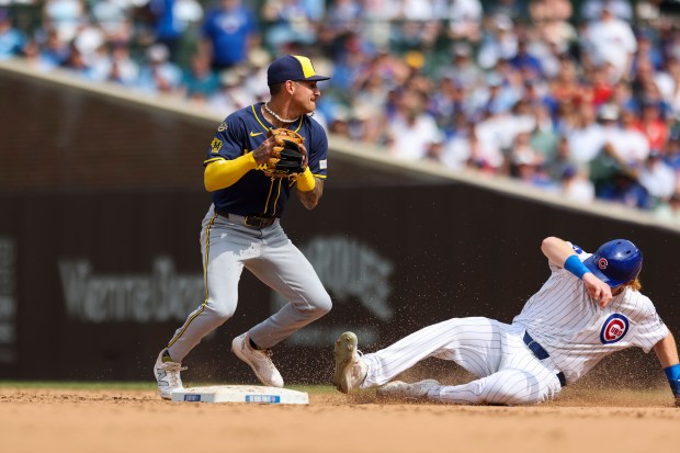 Milwaukee Brewers shortstop Joey Ortiz (3) gets Chicago Cubs outfielder Owen Caissie (19) out at second base with a force out during the seventh inning at Wrigley Field on Monday, Aug. 18, 2025. (Eileen T. Meslar/Chicago Tribune)