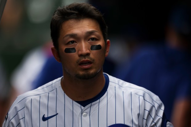 Chicago Cubs outfielder Seiya Suzuki (27) walks in the dugout after the Cubs gave up four runs during the eighth inning against the Milwaukee Brewers at Wrigley Field on Monday, Aug. 18, 2025. (Eileen T. Meslar/Chicago Tribune)