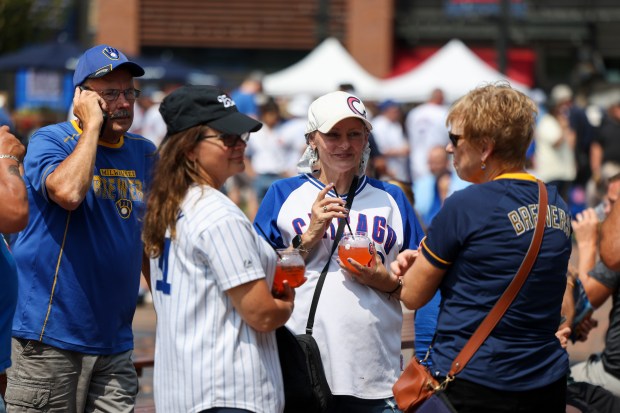 Chicago Cubs and Milwaukee Brewers fans hang out at Gallagher Way before the Chicago Cubs game against the Milwaukee Brewers at Wrigley Field on Monday, Aug. 18, 2025. (Eileen T. Meslar/Chicago Tribune)