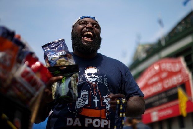 Marcus Lyons, a vendor of 36 years, sells peanuts and beads outside Wrigley Field before the Chicago Cubs game against the Milwaukee Brewers on Monday, Aug. 18, 2025. (Eileen T. Meslar/Chicago Tribune)