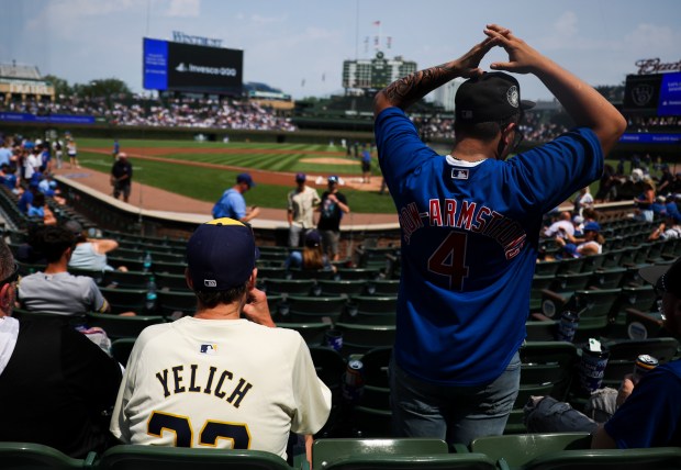 Milwaukee Brewers and Chicago Cubs fans wait for the Chicago Cubs game against the Milwaukee Brewers to start at Wrigley Field on Monday, Aug. 18, 2025. (Eileen T. Meslar/Chicago Tribune)