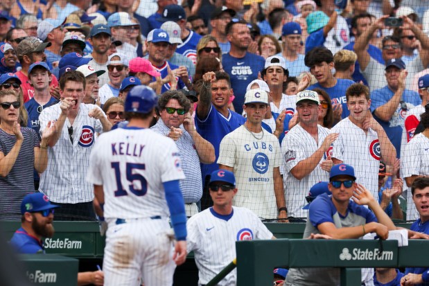 Chicago Cubs fans cheer after Chicago Cubs shortstop Dansby Swanson (7) hit a sacrifice fly to get catcher Carson Kelly (15) home and take the lead during the eighth inning against the Pittsburgh Pirates at Wrigley Field on Sunday, Aug. 17, 2025. (Eileen T. Meslar/Chicago Tribune)
