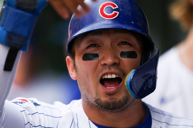 Chicago Cubs outfielder Seiya Suzuki (27) celebrates with his teammates after scoring to tie up the game during the sixth inning against the Pittsburgh Pirates at Wrigley Field on Sunday, Aug. 17, 2025. (Eileen T. Meslar/Chicago Tribune)