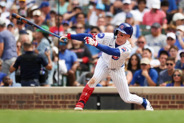 Chicago Cubs outfielder Pete Crow-Armstrong (4) hits a single during the sixth inning against the Pittsburgh Pirates at Wrigley Field on Sunday, Aug. 17, 2025. (Eileen T. Meslar/Chicago Tribune)