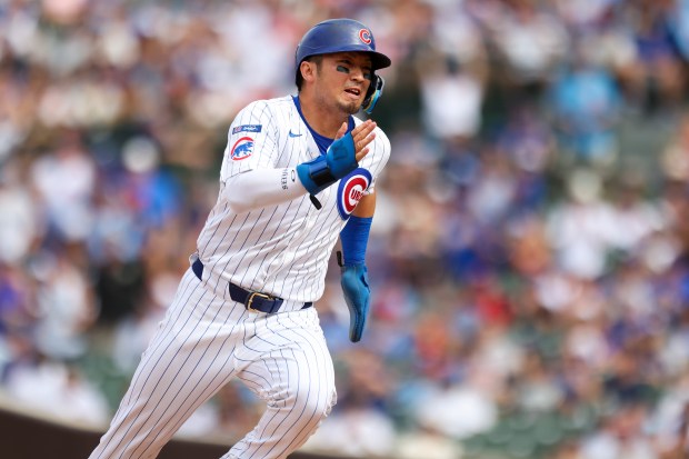 Chicago Cubs outfielder Seiya Suzuki (27) runs to third base on a single from outfielder Pete Crow-Armstrong (4) during the sixth inning against the Pittsburgh Pirates at Wrigley Field on Sunday, Aug. 17, 2025. (Eileen T. Meslar/Chicago Tribune)