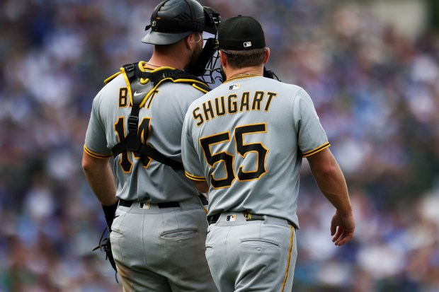 Pittsburgh Pirates catcher Joey Bart (14) speaks to pitcher Chase Shugart (55) during the seventh inning against the Chicago Cubs at Wrigley Field on Sunday, Aug. 17, 2025. (Eileen T. Meslar/Chicago Tribune)