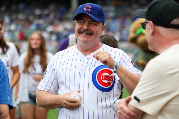 Actor Nick Offerman stands on the field before throwing a ceremonial first pitch before the Chicago Cubs game against the Pittsburgh Pirates at Wrigley Field on Sunday, Aug. 17, 2025. (Eileen T. Meslar/Chicago Tribune)