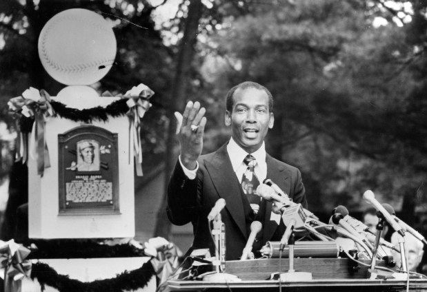 Taking his place alongside other baseball legends, Ernie Banks makes his acceptance speech on Aug. 8, 1977, during his induction into the National Baseball Hall of Fame in Cooperstown, N.Y. "My career and this honor belong to Mr. Philip K. Wrigley," he said of the Chicago Cubs' late owner. (Walter Kale/Chicago Tribune)