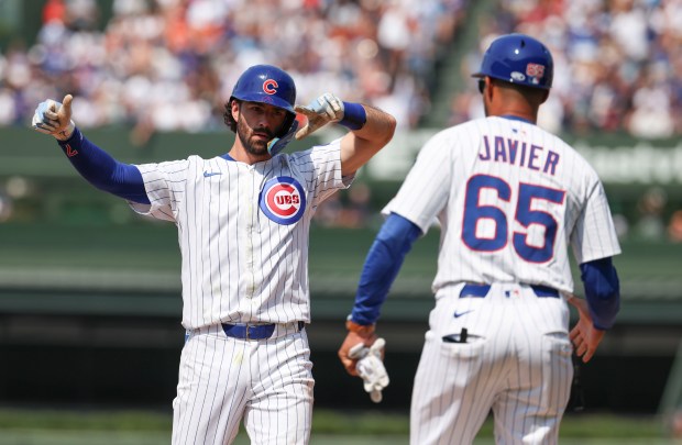 Chicago Cubs shortstop Dansby Swanson celebrates his RBI single to score Willi Castro in the sixth inning Sunday, Aug. 3, 2025, at Wrigley Field. (Brian Cassella/Chicago Tribune)
