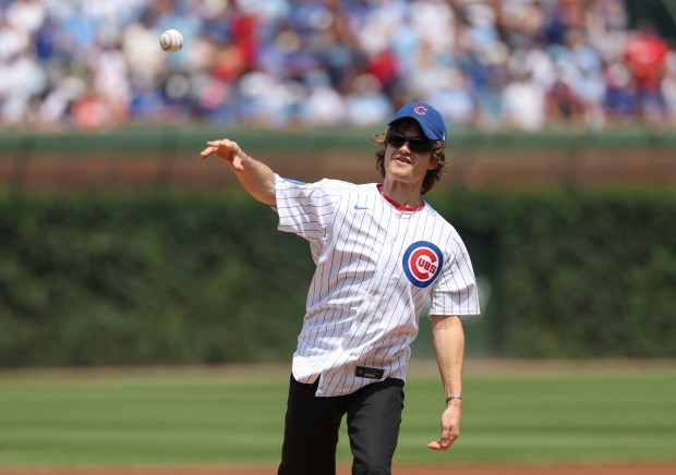 Joe "Djo" Kerry throws out a ceremonial first pitch Sunday, Aug. 3, 2025, at Wrigley Field. (Brian Cassella/Chicago Tribune)