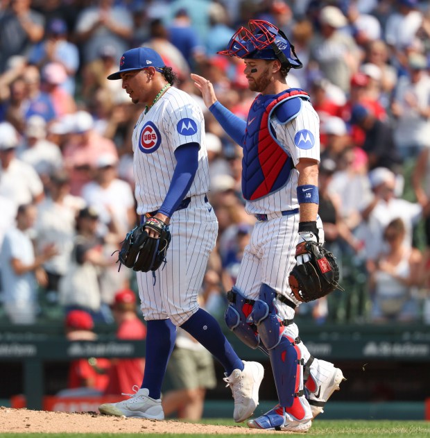 Chicago Cubs pitcher Daniel Palencia and catcher Carson Kelly celebrate the win over the Cincinnati Reds on Wednesday, Aug. 6, 2025, at Wrigley Field. (Brian Cassella/Chicago Tribune)