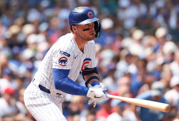 Chicago Cubs second baseman Nico Hoerner singles in teh third inning against the Cincinnati Reds on Wednesday, Aug. 6, 2025, at Wrigley Field. (Brian Cassella/Chicago Tribune)