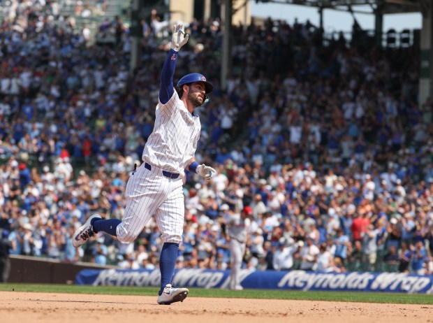 Chicago Cubs shortstop Dansby Swanson rounds the bases with a solo home run against the Cincinnati Reds in the seventh inning Wednesday, Aug. 6, 2025, at Wrigley Field. (Brian Cassella/Chicago Tribune)