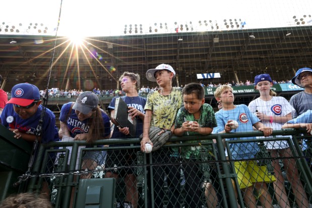 Chicago Cubs fans wait for autographs after the game against the Cincinnati Reds on Wednesday, Aug. 6, 2025, at Wrigley Field. (Brian Cassella/Chicago Tribune)
