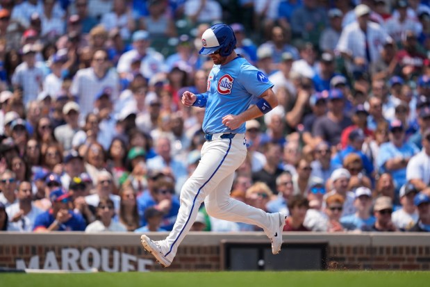 Cubs catcher Carson Kelly scores on a sacrifice fly by Ian Happ during the second inning against the Orioles on Friday, Aug. 1, 2025, at Wrigley Field. (AP Photo/Erin Hooley)